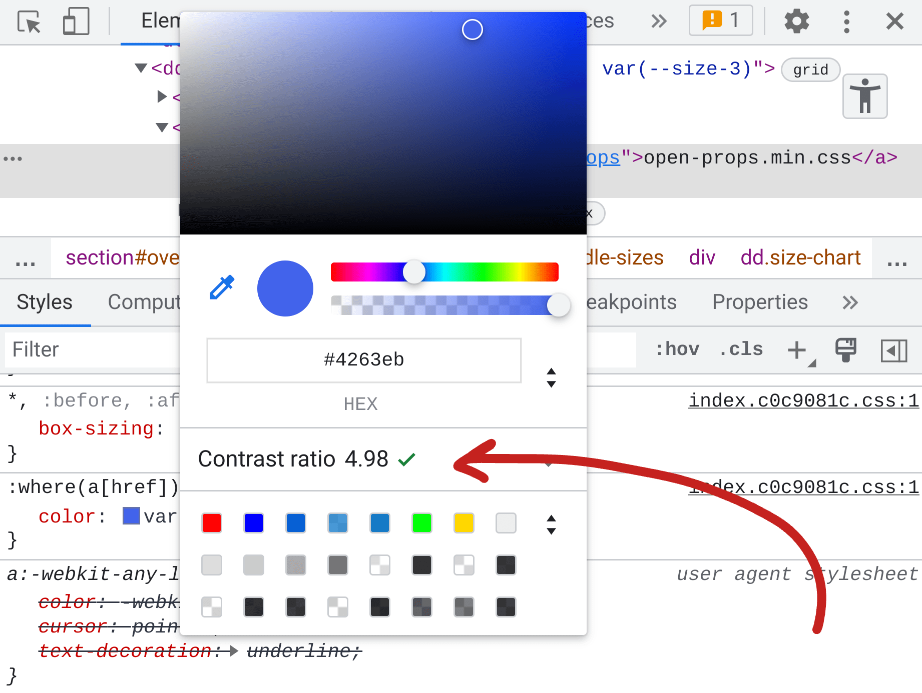 Screenshot del riquadro Elementi di DevTools, negli stili viene mostrato il selettore dei colori e al centro viene riportato il rapporto di contrasto del colore di 4,98.