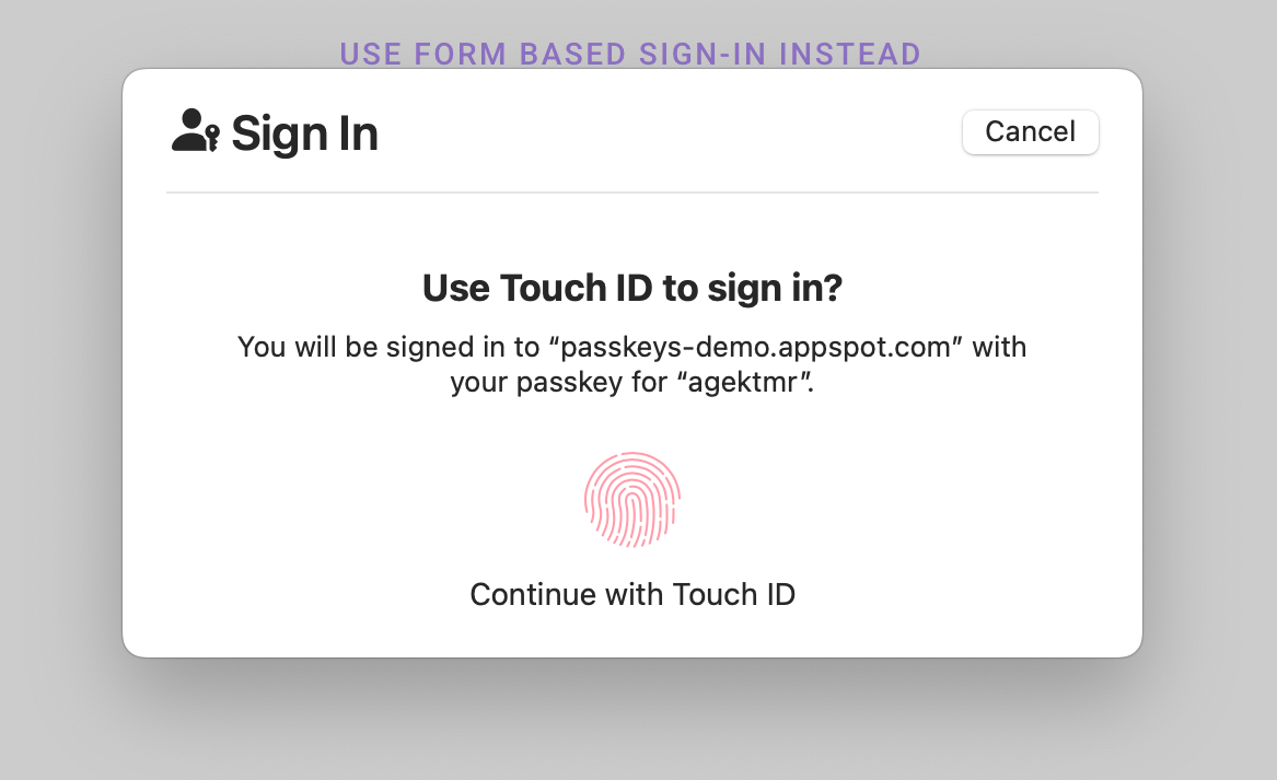 macOS 上の iCloud キーチェーン上のユーザー確認ダイアログのスクリーンショット。ユーザーに Touch ID によるログインを求めるダイアログに、認証をリクエストしているオリジンとユーザー名が表示されます。ダイアログの右上には [キャンセル] ボタンがあります。