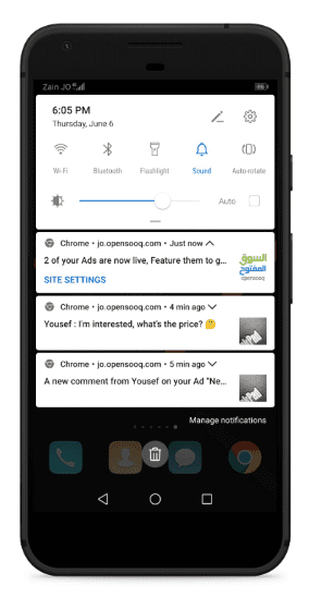 Um smartphone mostrando notificações do OpenSooq.
